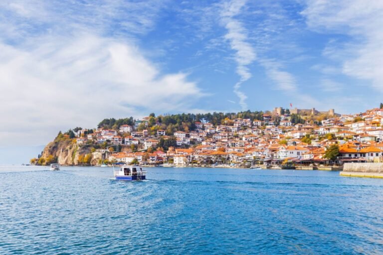 Boats riding by townscape of Lake Ohrid, North Macedonia