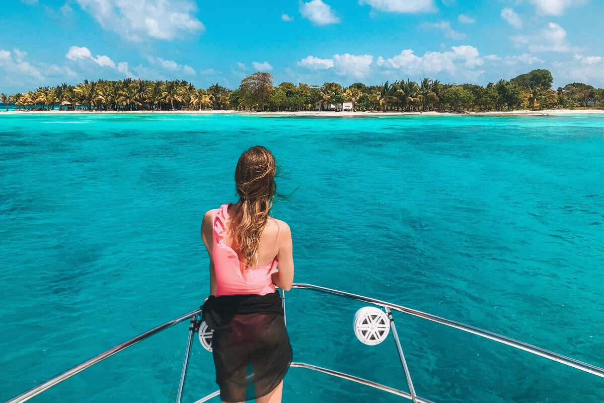 Young Woman Admiring A View Of An Island In The Caribbean Sea, Belize
