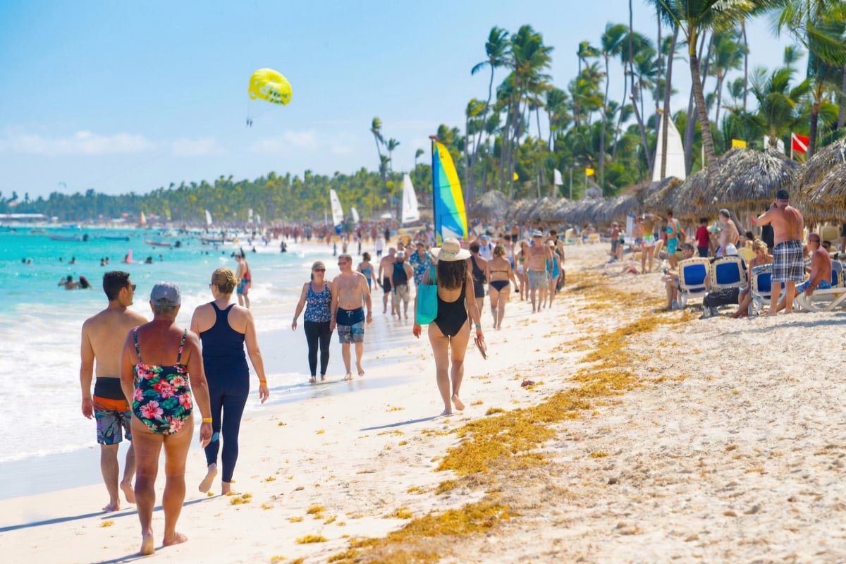 People walking on beach in Punta Cana, Dominican Republic