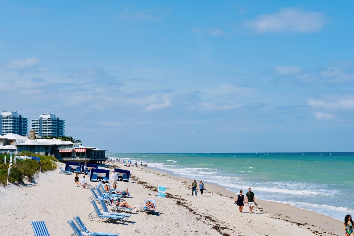Beachgoers enjoying sunny day in Vero Beach, Florida